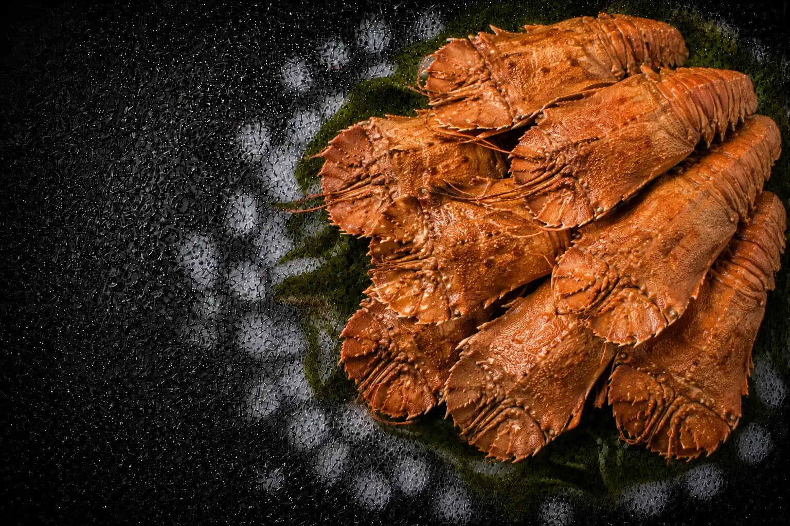Fried prawns on a dark surface with a virus-like pattern overlay
